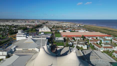 Aerial-drone-footage-of-the-famous-Butllins-holiday-camp-based-in-the-seaside-town-of-Skegness-Lancashire,-UK