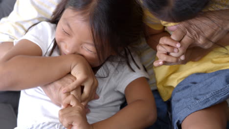 slow motion shot of grandfather and granddaughters laughing