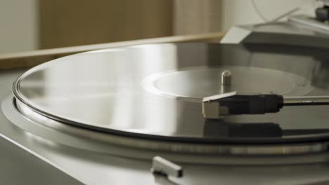 modern vinyl turntable playing at home