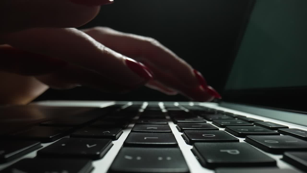 Woman Typing on Laptop Keyboard