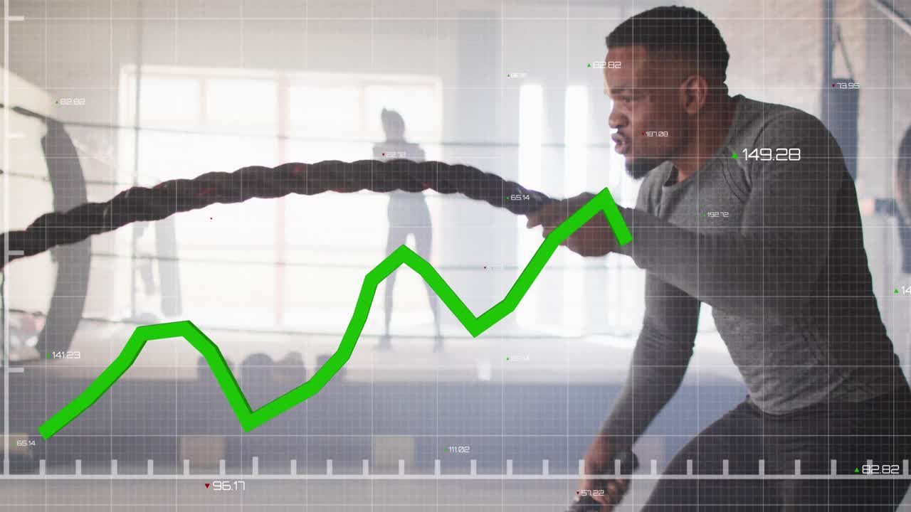 animación de procesamiento de datos sobre hombre afroamericano haciendo ejercicio con cuerdas en el gimnasio