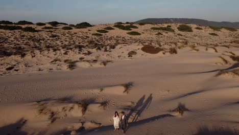 loving bride and groom enjoying romantic moment on sandy shore