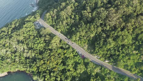 Aerial-view-from-above-showing-cars-passing-by-Interpraias-road-at-Balneario-Camboriu,-Santa-Catarina,-Brazil