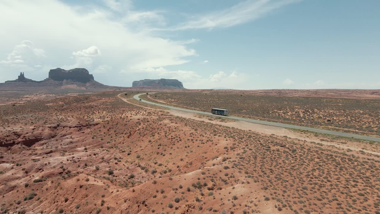A tour bus drive to the magnificent Monument Valley. Marvel at the stunning desert landscapes that surround you as you approach this iconic destination.

Shot in 4K.