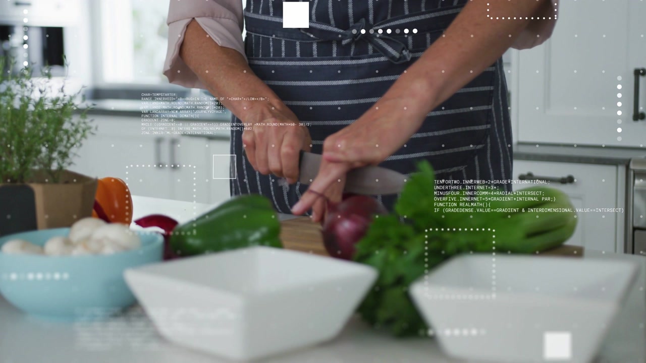 Woman Chopping Onion and Fresh Vegetables in a Kitchen