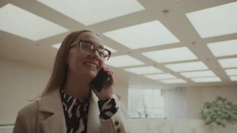 businesswoman having conversation on mobile phone in office