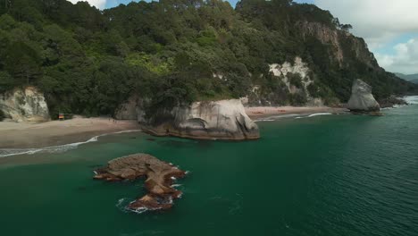 Clouds-rolling-over-the-mountains-of-New-Zealand-and-onto-Hahei-beach