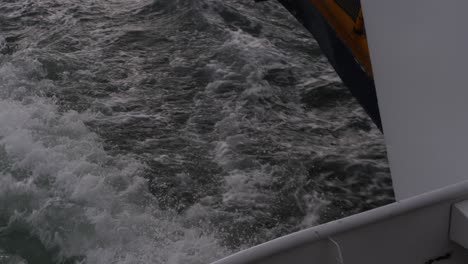 wake splashing from a ferry sailing in north stradbroke island