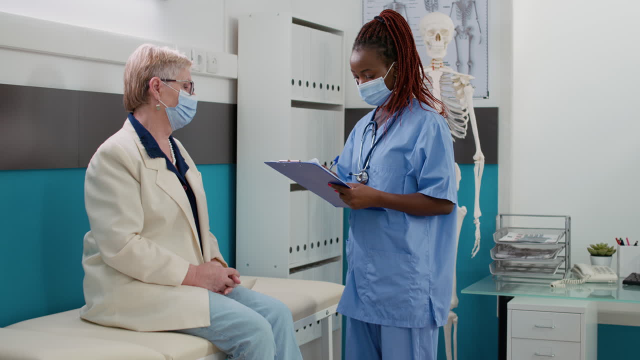 Doctor examining patient in clinic