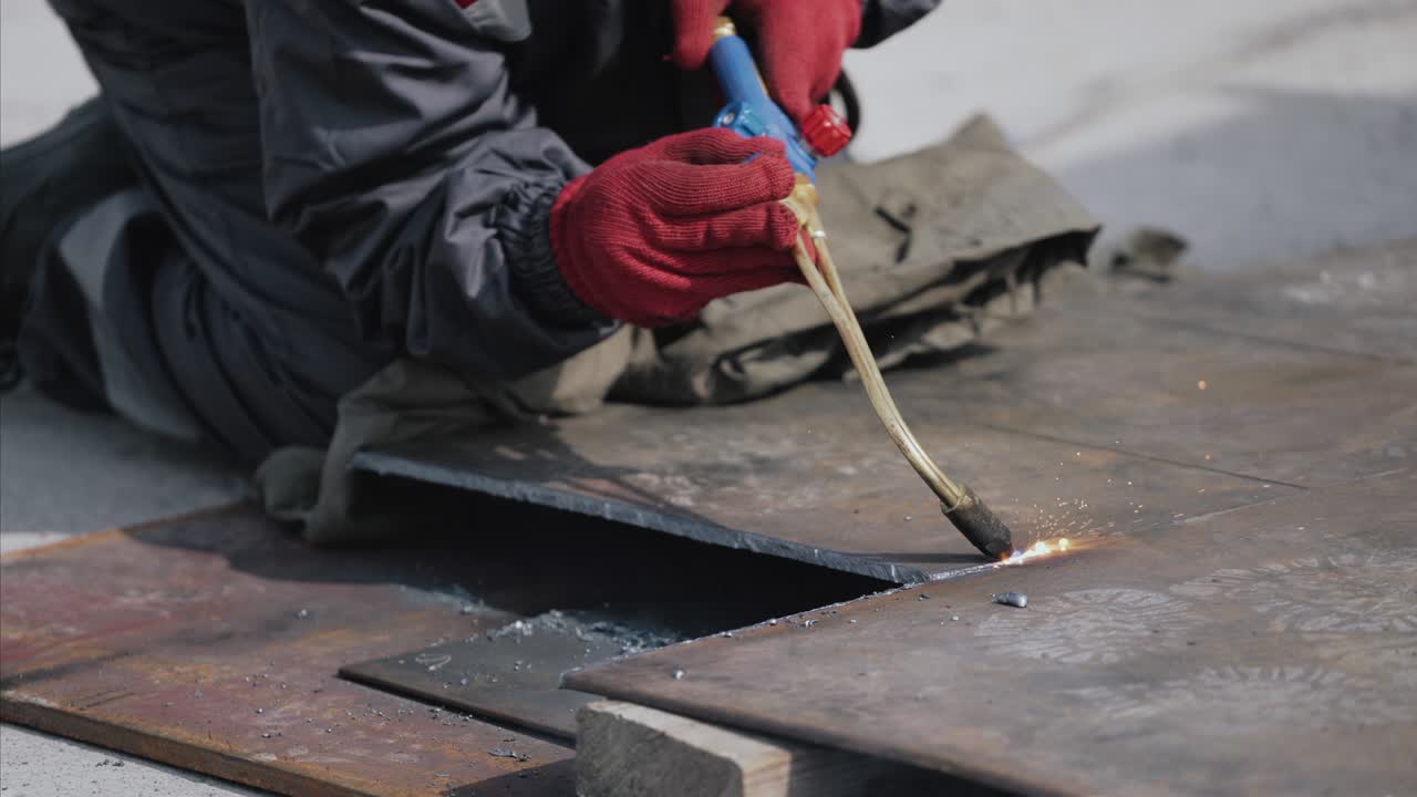 Close-up of quartz and glass welding made with gas high temperature machine. Flame is heating quartz till red colour and it starts melting.