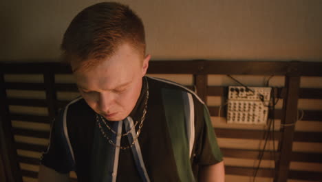 male musician playing drums during a band rehearsal in recording studio 3