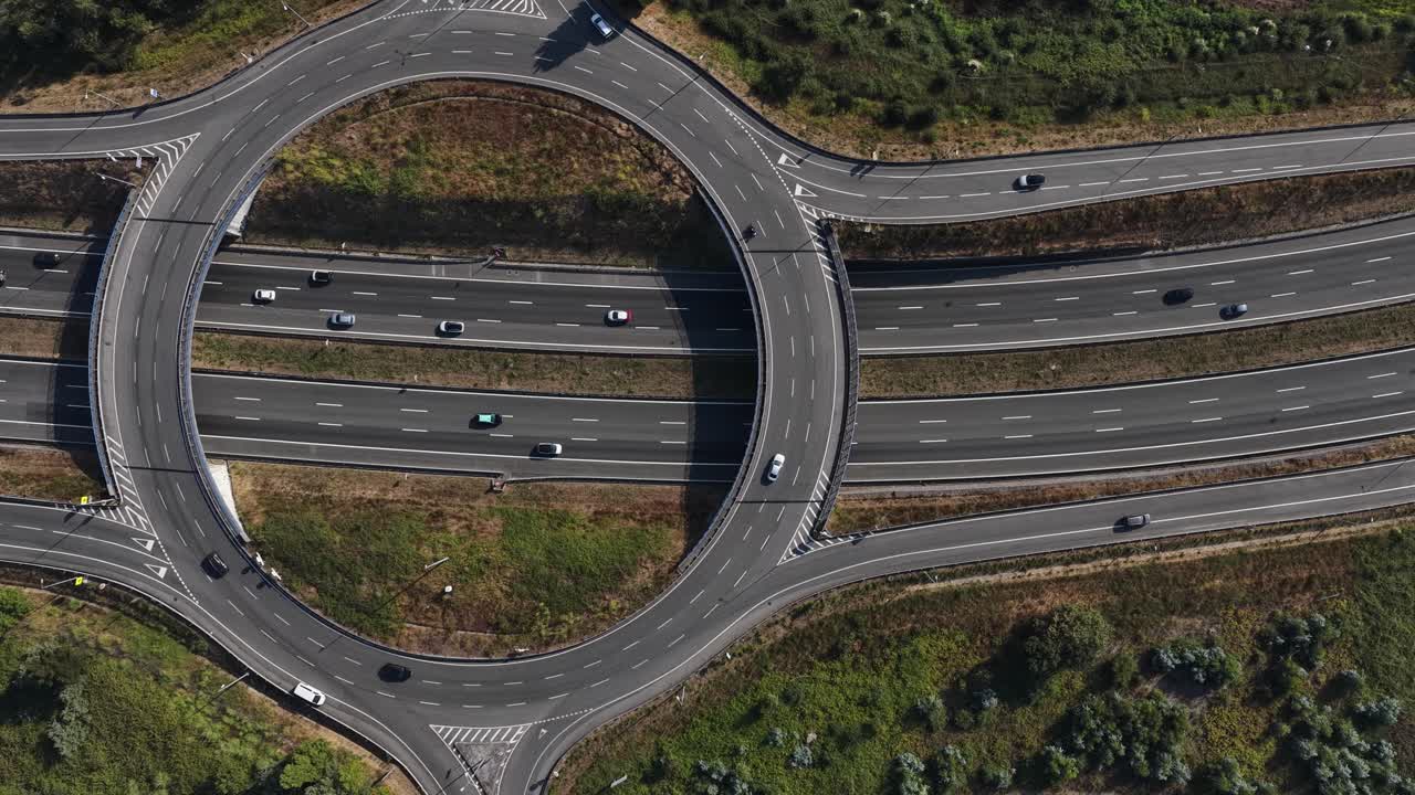 Aerial panning of a highway roundabout drone going sideways