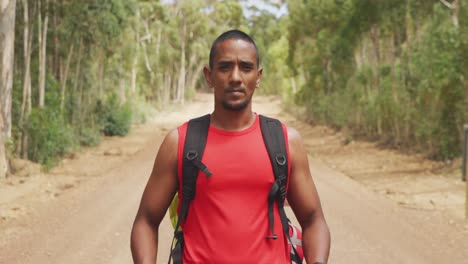 Sporty-mixed-race-man-with-prosthetic-leg-hiking