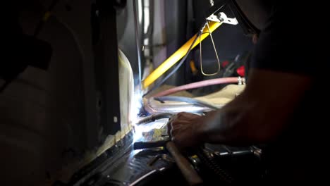 an employee of a garage using a machine