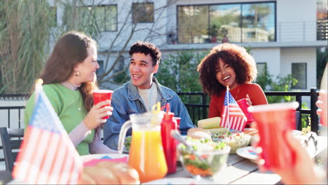 Friends Celebrating with Food and American Flags