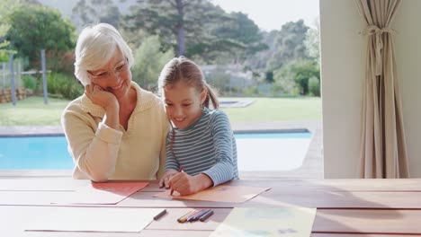 Grandmother-and-little-girl-drawing-together-4K-4k