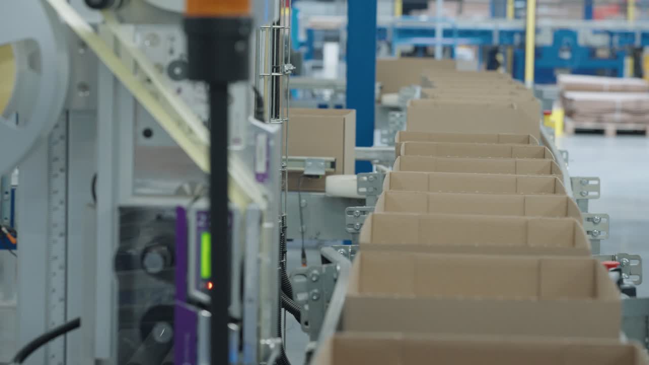 Boxes moving along a conveyor belt getting ready to be shipped in a factory in France
