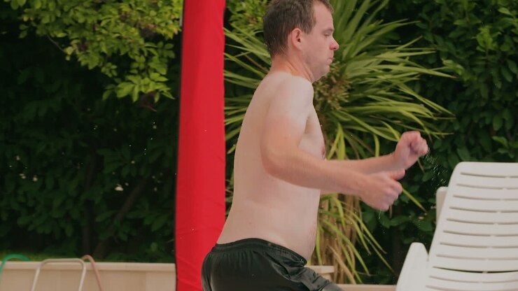 Man Jumping Into Swimming Pool 6