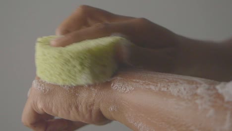 washing hands with soap and sponge