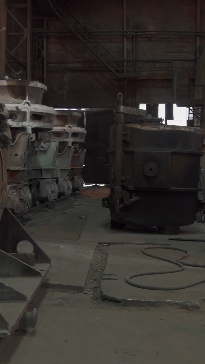 Industrial Scene in a Foundry with Heavy Machinery and a Worker