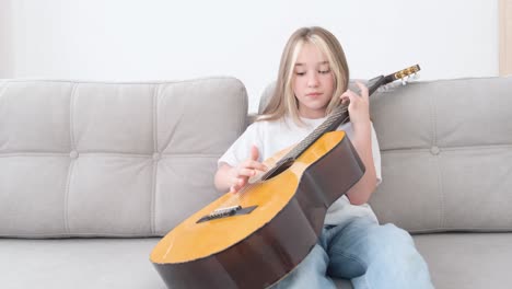 little girl learning to play video games.