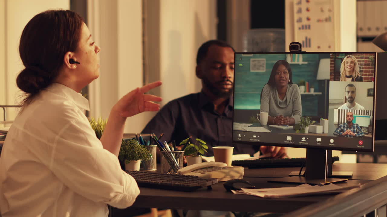 Young adult attending videocall company meeting