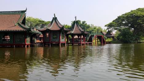 serene view of asian-style buildings over water