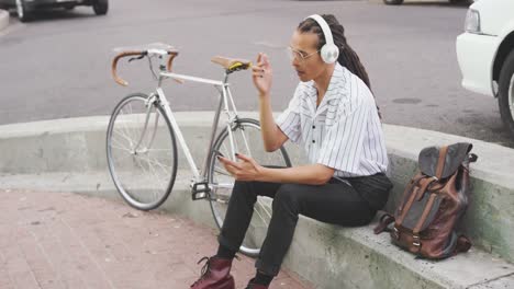 Mixed-race-man-listening-to-music-with-headphone