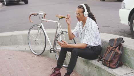 mixed race man listening to music with headphone