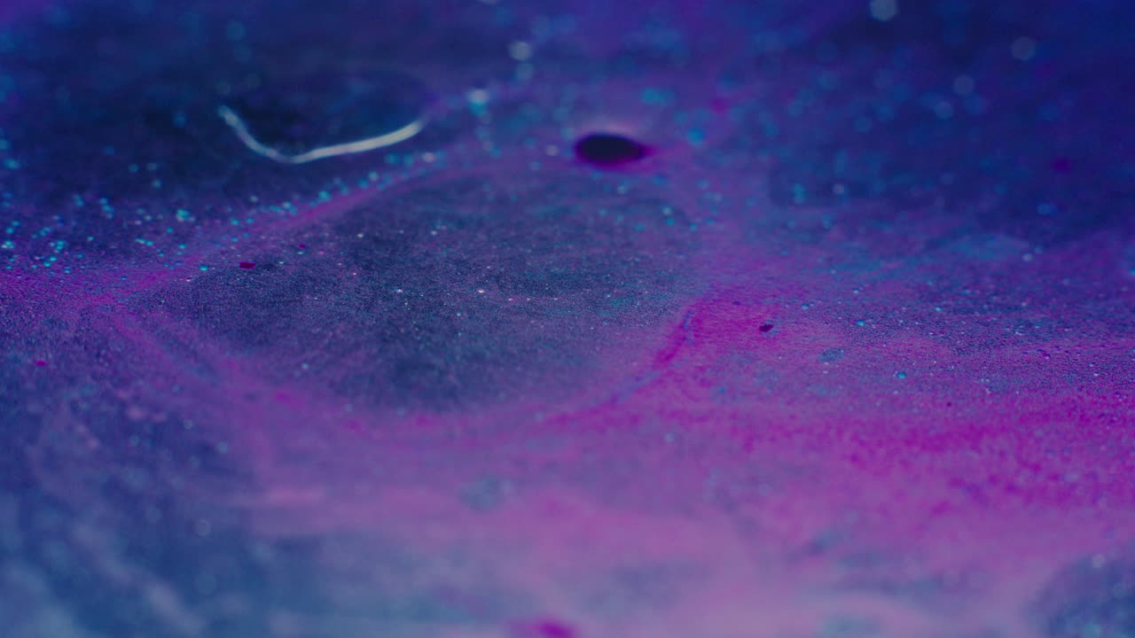 Colourful, organic, liquids macro shots buzzing and flowing