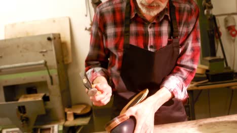 cobbler hammering on a shoe