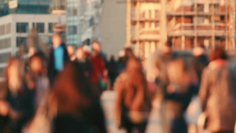 a crowd of people walking together on the street