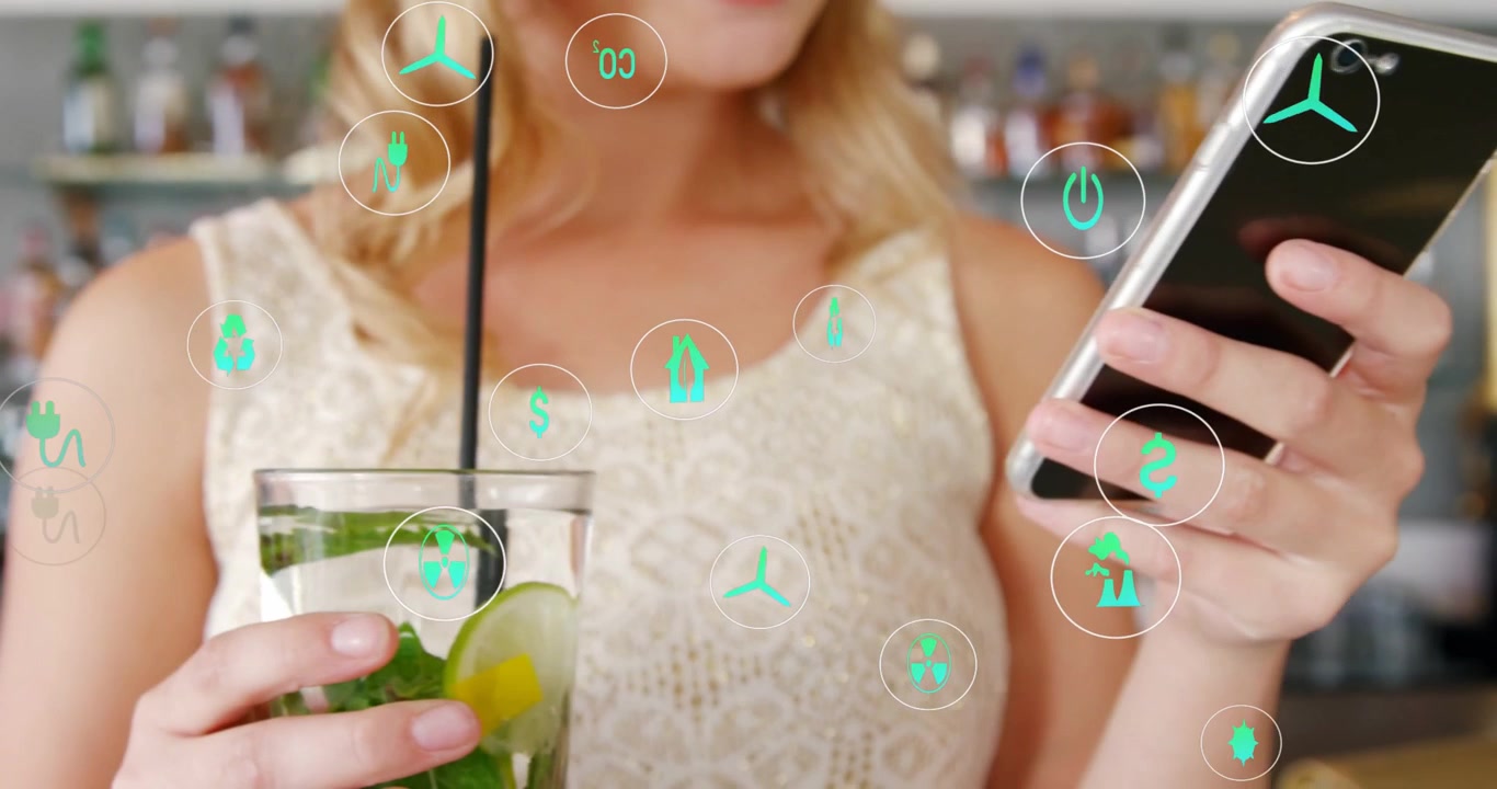 Woman tapping phone and checking tech app, causing green icons shifting as placing phone on counter