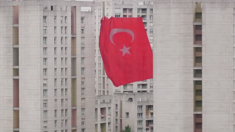 turkish flag flying over apartment buildings