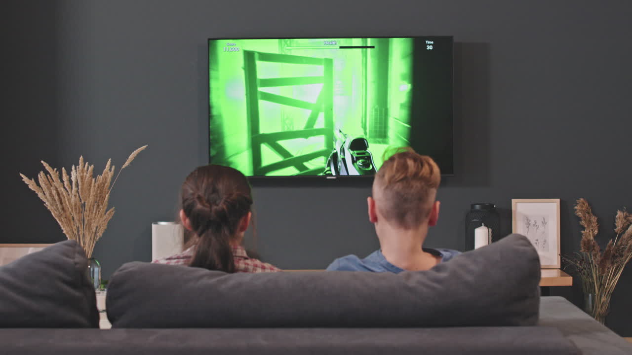 Siblings Playing Shooter Video Games