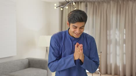 happy indian man greeting everybody with namaste