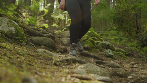 Woman-walking-down-stony-path-in-Lynn-Canyon-Park