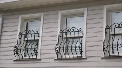 building facade with ornate metal window balconies