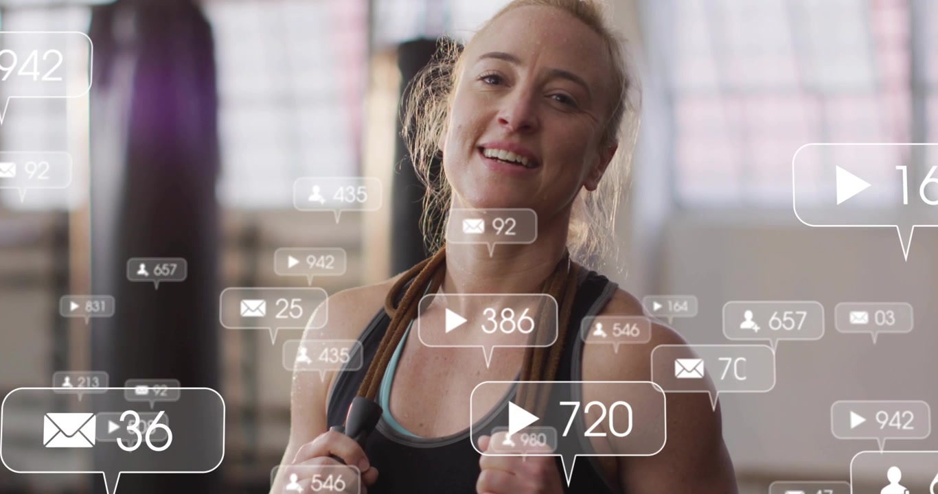 Camera pulling back on woman holding jump rope, alert bubbles growing, showing social buzz in gym