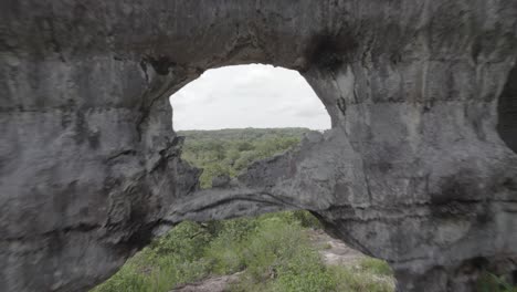 geological formation of the puerta de orión, in san josé del guaviare, colombia - aerial pullback