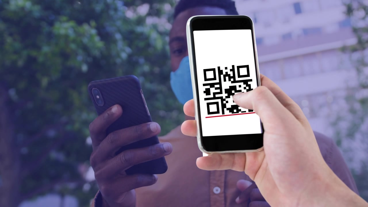Man Wearing Face Mask Using Smartphone with QR Code Overlay