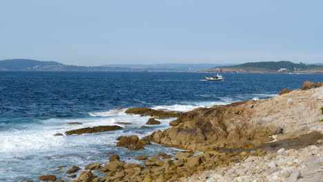 Fishing-Boat-on-the-Blue-Atlantic-Ocean,-Coastal-Scene,-Slow-Motion