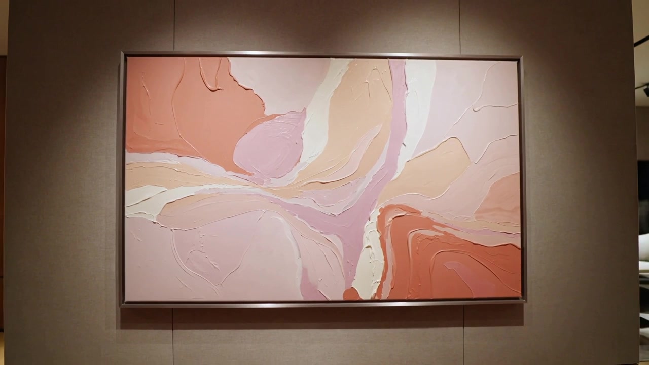 Camera starting slow push and reframing large abstract painting in lobby corridor, showing texture