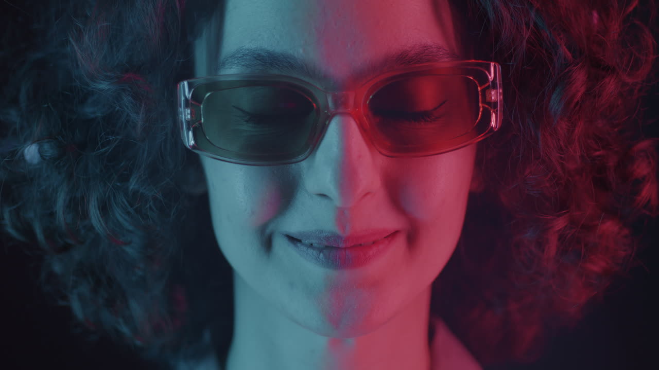 Woman with Neon Lighting and Retro Sunglasses