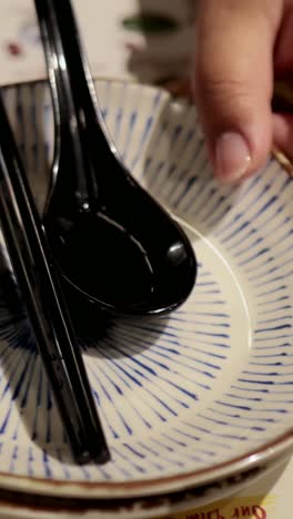 dining setting with chopsticks and spoons