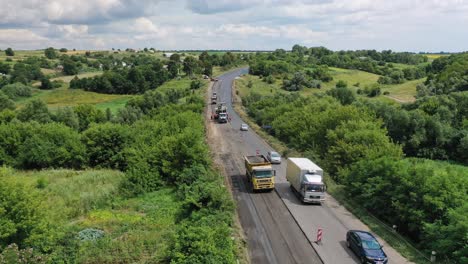 Aerial view of highway construction site. Asphalting construction works with commercial repair equipment