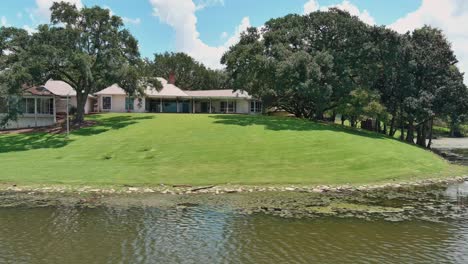 drone view of homes off lake in baton rouge, louisiana