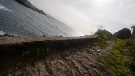 Dutch-angle-looking-up-a-old-fisherman-boat-launch,-at-Bessy's-Cove,-The-Enys,-cornwall