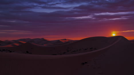 sunrise or sunset over sand dunes