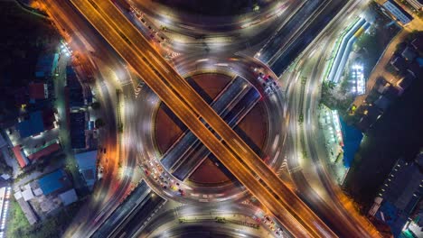 time lapse,hyper lapse ,aerial view and top view of traffic on city streets in bangkok , thailand. expressway with car lots. beautiful roundabout road in the city center.